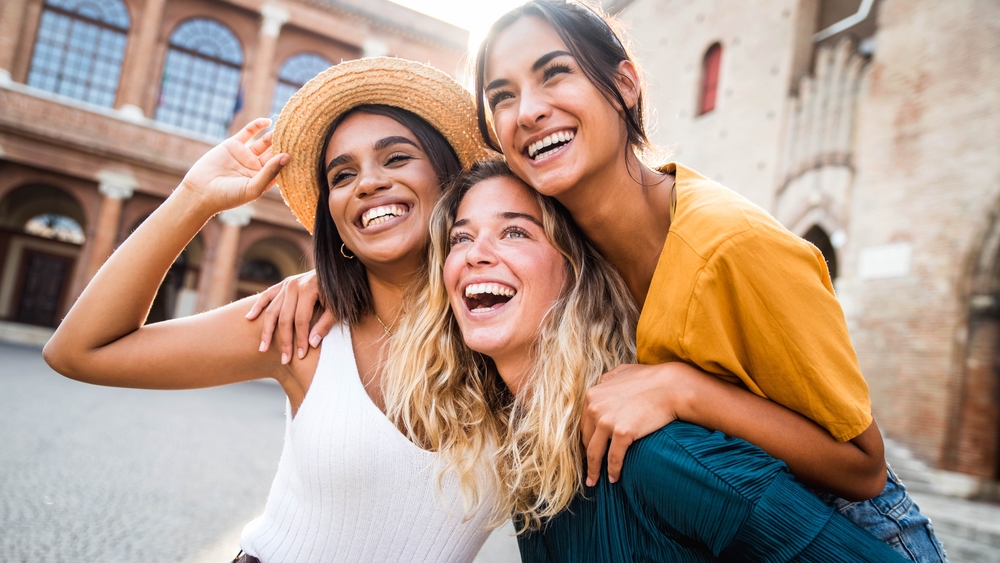 Three,Young,Multiracial,Women,Having,Fun,On,City,Street,Outdoors